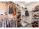 Well-organized walk-in closet with ample shelving, hanging space, and storage baskets for efficient storage at 1635 E Harrison St, Chandler, AZ 85225