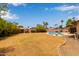 Large backyard with pool, mature trees, and privacy fence at 1874 E Huntington Dr, Tempe, AZ 85282