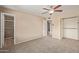 Bedroom with neutral colors, ceiling fan, with entry to bathroom and hallway at 1874 E Huntington Dr, Tempe, AZ 85282