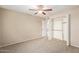 Bedroom with neutral tones, a ceiling fan, closet, and doorway to another room at 1874 E Huntington Dr, Tempe, AZ 85282