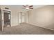 Bedroom with a ceiling fan and walk-in closet for maximum storage space at 1874 E Huntington Dr, Tempe, AZ 85282