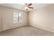 Bright bedroom with neutral tones, ceiling fan, and natural light from the window at 1874 E Huntington Dr, Tempe, AZ 85282