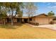 Charming single-story home featuring a two-car garage and mature landscaping in a suburban setting at 1874 E Huntington Dr, Tempe, AZ 85282