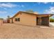 Exterior of tan house with gravel, pool, and sliding glass doors at 1874 E Huntington Dr, Tempe, AZ 85282