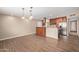 Open kitchen with stainless steel appliances and generous counter space with pendant lights at 1874 E Huntington Dr, Tempe, AZ 85282