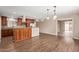 Well-appointed kitchen with dark cabinetry, breakfast bar, and access to sunroom at 1874 E Huntington Dr, Tempe, AZ 85282