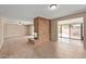 Spacious living room with brick fireplace, tile floors and access to the backyard patio at 1874 E Huntington Dr, Tempe, AZ 85282