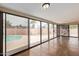 Bright sun room with large sliding glass doors leading to the pool area at 1874 E Huntington Dr, Tempe, AZ 85282