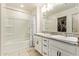 Clean bathroom features a double sink vanity with granite countertops and a shower-tub combo at 19951 W Wilson St, Buckeye, AZ 85326