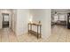 Bright entryway with tiled floor, a table, and views into the home at 19951 W Wilson St, Buckeye, AZ 85326