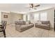 Cozy living area with couches and a decorative wall that looks into the dining area at 19951 W Wilson St, Buckeye, AZ 85326