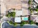 Aerial shot of a property with a pool, sports area, and verdant landscaping, offering resort-style amenities at 20439 E Palomino Dr, Queen Creek, AZ 85142