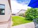 Green backyard with patio; perfect for outdoor living and relaxation, a true private retreat at 20439 E Palomino Dr, Queen Creek, AZ 85142