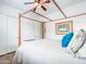 A bright bedroom featuring a canopy bed and an attached door at 20439 E Palomino Dr, Queen Creek, AZ 85142