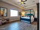Bright bedroom featuring a ceiling fan, a canopy bed and windows at 20439 E Palomino Dr, Queen Creek, AZ 85142