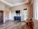 Spacious bedroom features stylish wood floors, a sleek TV, and comfortable furnishings at 20439 E Palomino Dr, Queen Creek, AZ 85142