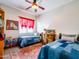 Shared ' bedroom featuring hardwood floors, two twin beds and colorful decoration at 20439 E Palomino Dr, Queen Creek, AZ 85142