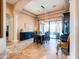 Elegant dining room with travertine floors, a tray ceiling, and a view of the backyard patio at 20439 E Palomino Dr, Queen Creek, AZ 85142