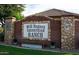 Stone and brick sign for Will Rogers Equestrian Ranch with lush greenery and a well-maintained landscape at 20439 E Palomino Dr, Queen Creek, AZ 85142