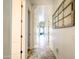 Bright hallway features tile floors and arched ceilings, creating an elegant and open feel at 20439 E Palomino Dr, Queen Creek, AZ 85142