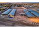 Aerial view of horse property featuring stables, arenas, and night lighting at 20439 E Palomino Dr, Queen Creek, AZ 85142