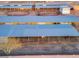 Aerial view of horse stables, with runs, arenas, and covered shelters at 20439 E Palomino Dr, Queen Creek, AZ 85142