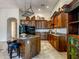 Spacious kitchen features a central island with seating and stainless steel appliances at 20439 E Palomino Dr, Queen Creek, AZ 85142
