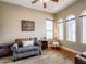 Cozy living room with natural light, hardwood floors and comfortable seating at 20439 E Palomino Dr, Queen Creek, AZ 85142