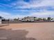 This property includes RV parking with ample spaces under a bright blue sky at 20439 E Palomino Dr, Queen Creek, AZ 85142