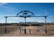 Will Rogers Equestrian Ranch entrance in Queen Creek; facility with dirt, fencing, and mountains in the background at 20439 E Palomino Dr, Queen Creek, AZ 85142
