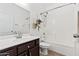 Bathroom featuring a single sink vanity and a bathtub/shower combination with white tiled walls at 21362 E Puesta Del Sol Rd, Queen Creek, AZ 85142