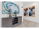 Entryway with modern console, decorative vases, and elegant artwork on the walls at 21362 E Puesta Del Sol Rd, Queen Creek, AZ 85142