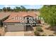 Charming single-Gathering home featuring desert landscaping and a two-car garage in Queen Creek, Arizona at 21362 E Puesta Del Sol Rd, Queen Creek, AZ 85142