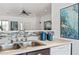 Kitchen view featuring a stainless steel sink, tiled backsplash, and modern blue decorative accessories at 21362 E Puesta Del Sol Rd, Queen Creek, AZ 85142