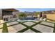 Inviting backyard pool, spa, and kitchen with travertine surround create a relaxing oasis for entertaining and enjoying the outdoors at 21632 W Hillcrest Blvd, Buckeye, AZ 85396