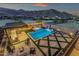 Aerial view of a property featuring a backyard oasis with a pool, spa, and outdoor living area at 21632 W Hillcrest Blvd, Buckeye, AZ 85396