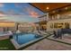 An inviting backyard with a pool, spa, outdoor kitchen, and fire pit, perfect for outdoor entertaining at 21632 W Hillcrest Blvd, Buckeye, AZ 85396
