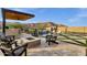 Inviting backyard pool, spa, and patio with outdoor seating create a relaxing oasis for entertaining and enjoying the outdoors at 21632 W Hillcrest Blvd, Buckeye, AZ 85396