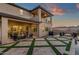 Spacious backyard with an outdoor seating area, outdoor kitchen, and luxurious desert views at 21632 W Hillcrest Blvd, Buckeye, AZ 85396
