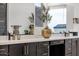Close-up of a modern bathroom vanity featuring quartz countertop and black faucet at 21632 W Hillcrest Blvd, Buckeye, AZ 85396