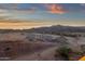 Expansive desert view highlighting the natural landscape and sky during a vibrant sunset at 21632 W Hillcrest Blvd, Buckeye, AZ 85396
