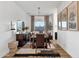 Dining room featuring a large table, seating for eight, chandelier, and decor at 21632 W Hillcrest Blvd, Buckeye, AZ 85396