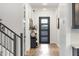 Bright entryway featuring a modern front door and decor at 21632 W Hillcrest Blvd, Buckeye, AZ 85396