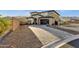 Beautiful two-story home with a well-maintained front yard and mountain views at 21632 W Hillcrest Blvd, Buckeye, AZ 85396
