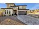 Home exterior with modern design, desert landscaping, and stylish front door at 21632 W Hillcrest Blvd, Buckeye, AZ 85396
