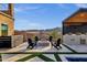 Inviting outdoor firepit surrounded by Adirondack chairs, creating a cozy gathering space near the pool and kitchen at 21632 W Hillcrest Blvd, Buckeye, AZ 85396