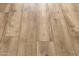 Close-up of light brown wood-look plank flooring at 21632 W Hillcrest Blvd, Buckeye, AZ 85396