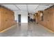 Spacious garage featuring epoxy floors and custom cabinets providing ample storage solutions for tools and equipment at 21632 W Hillcrest Blvd, Buckeye, AZ 85396
