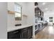 Modern kitchen with white countertops, dark cabinets, stainless steel appliances, and view of mountains at 21632 W Hillcrest Blvd, Buckeye, AZ 85396