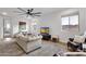 Spacious living room with comfortable seating, modern decor, and bright windows showcasing outdoor views at 21632 W Hillcrest Blvd, Buckeye, AZ 85396